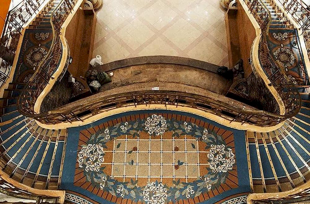 The spiral staircase at the museum stands out with its intricate carvings on the railing, beautifully preserved over time